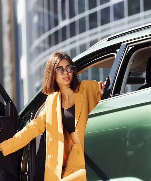 Traveler exiting car representing convenient airport parking services.